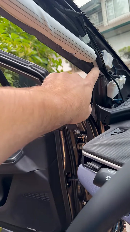 Exposed Subaru A-pillar showing factory wiring and airbag area