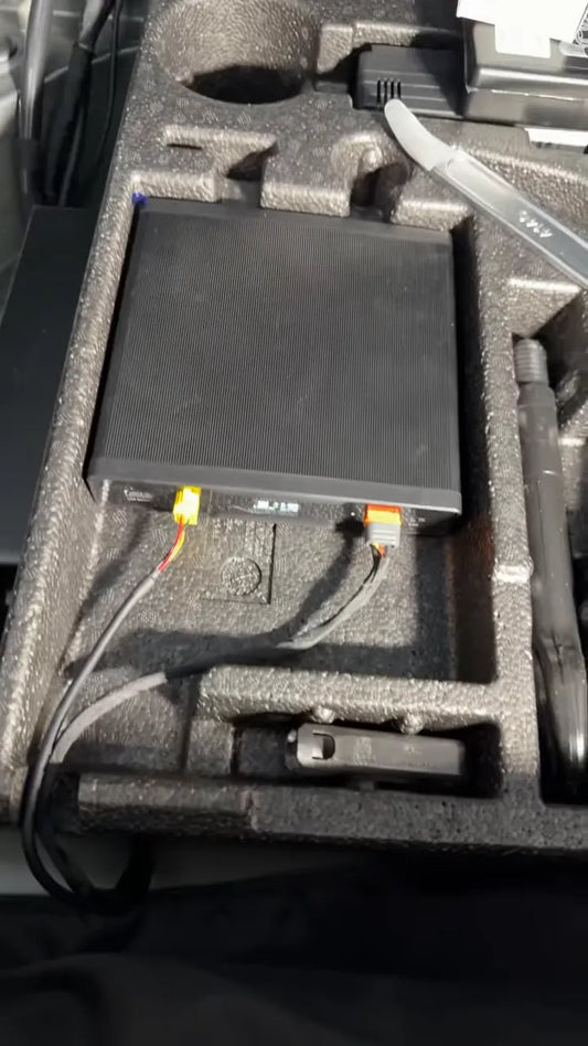 battery pack sitting in rear foam storage tray with connected wires